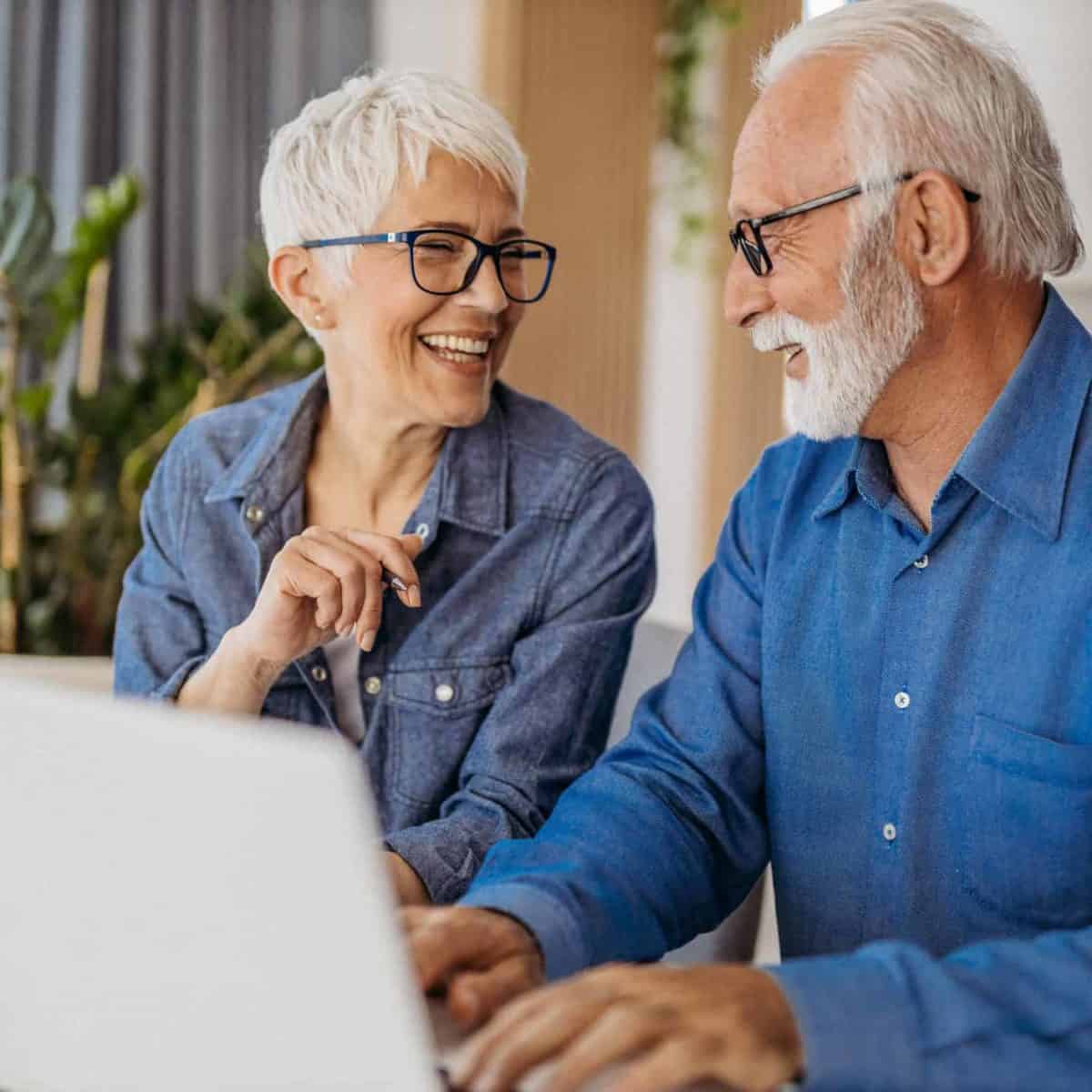 LAWNDALE Precious Metals IRA & Investing Company Copy of Senior couple at laptop smiling GettyImages 1323096524 1200x1200 1